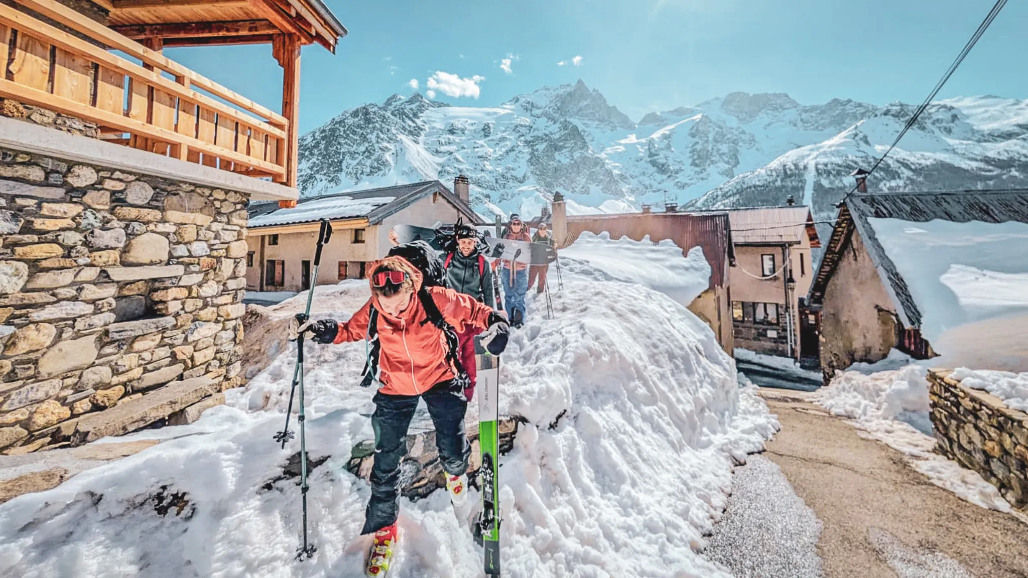 A group of ski tourers on snowy slopes in La Grave.
