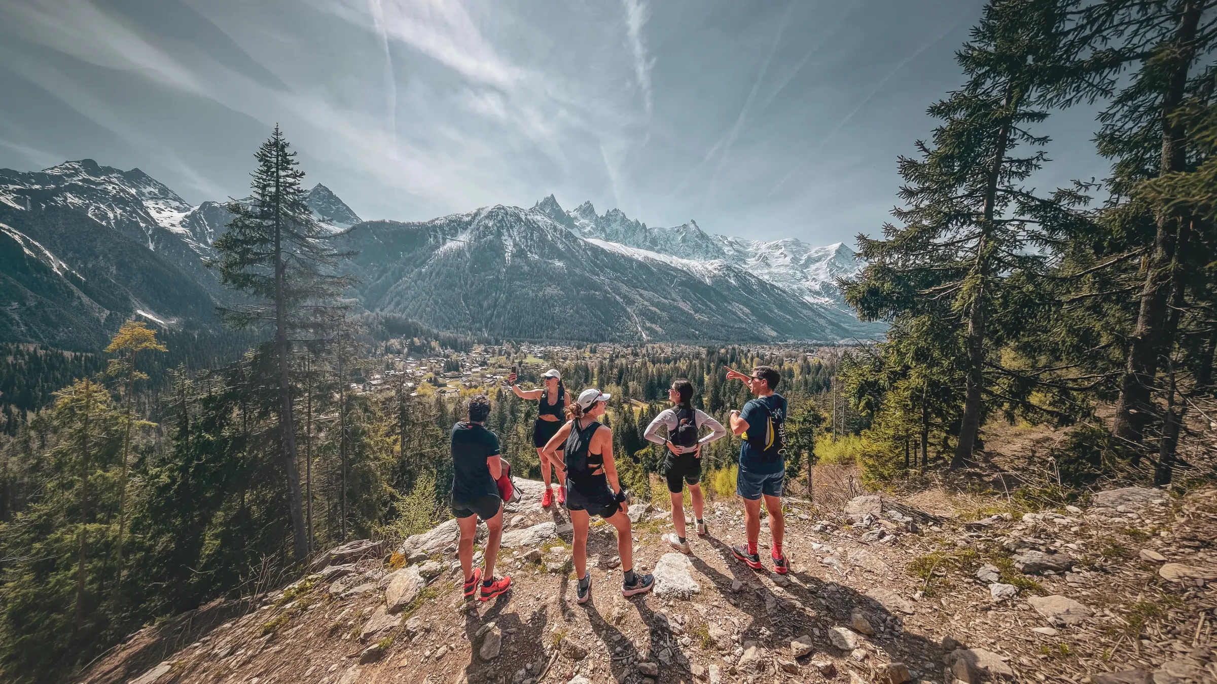 Five riders admire the spectacular mountain scenery of Chamonix, with Mont Blanc in the background.