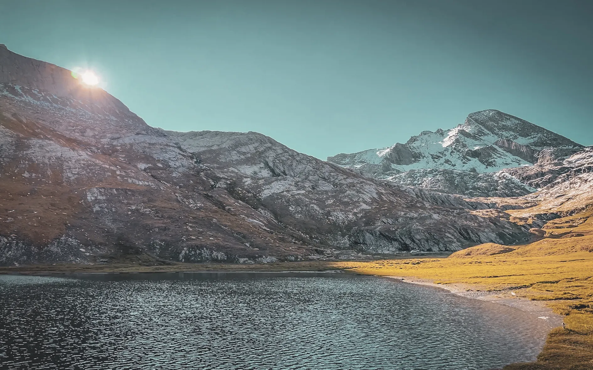 Lac du Grand Laus, at 2600 m, its waters reflecting the surrounding peaks at sunset.