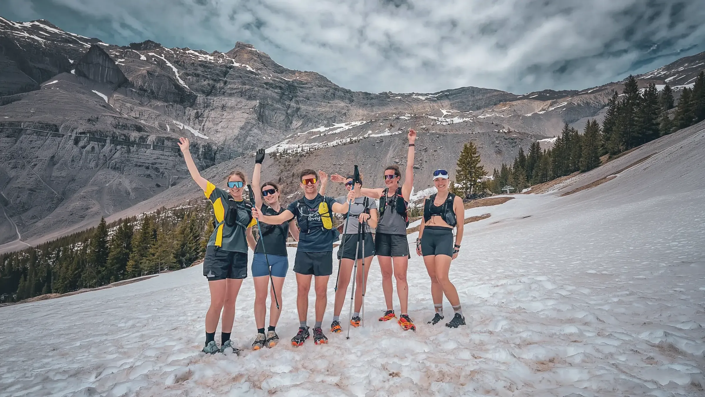 An enthusiastic group of mountain runners, surrounded by the majestic scenery of Mont Blanc.