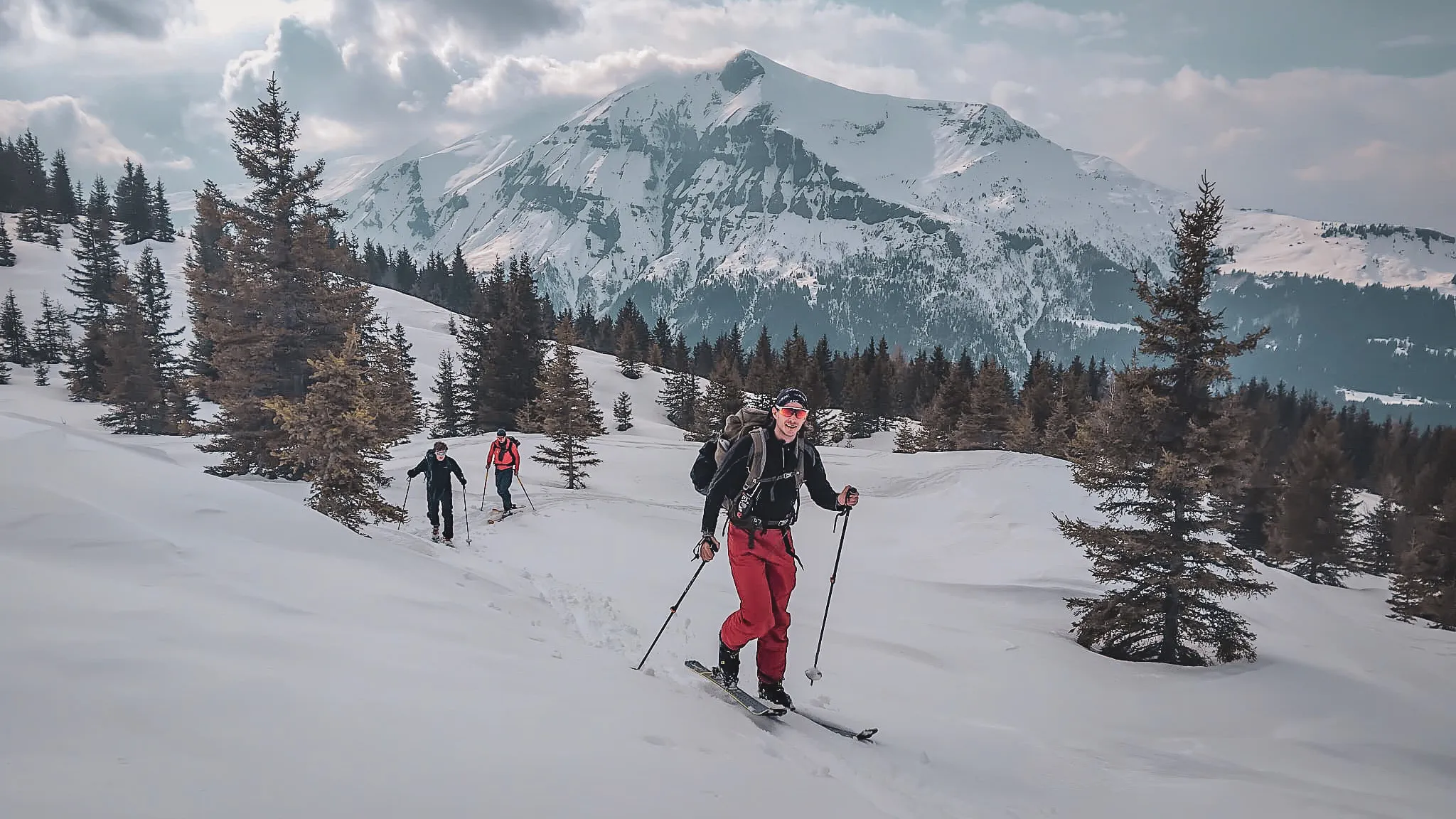 Ski tourers in the snow with Mont Blanc in the background
