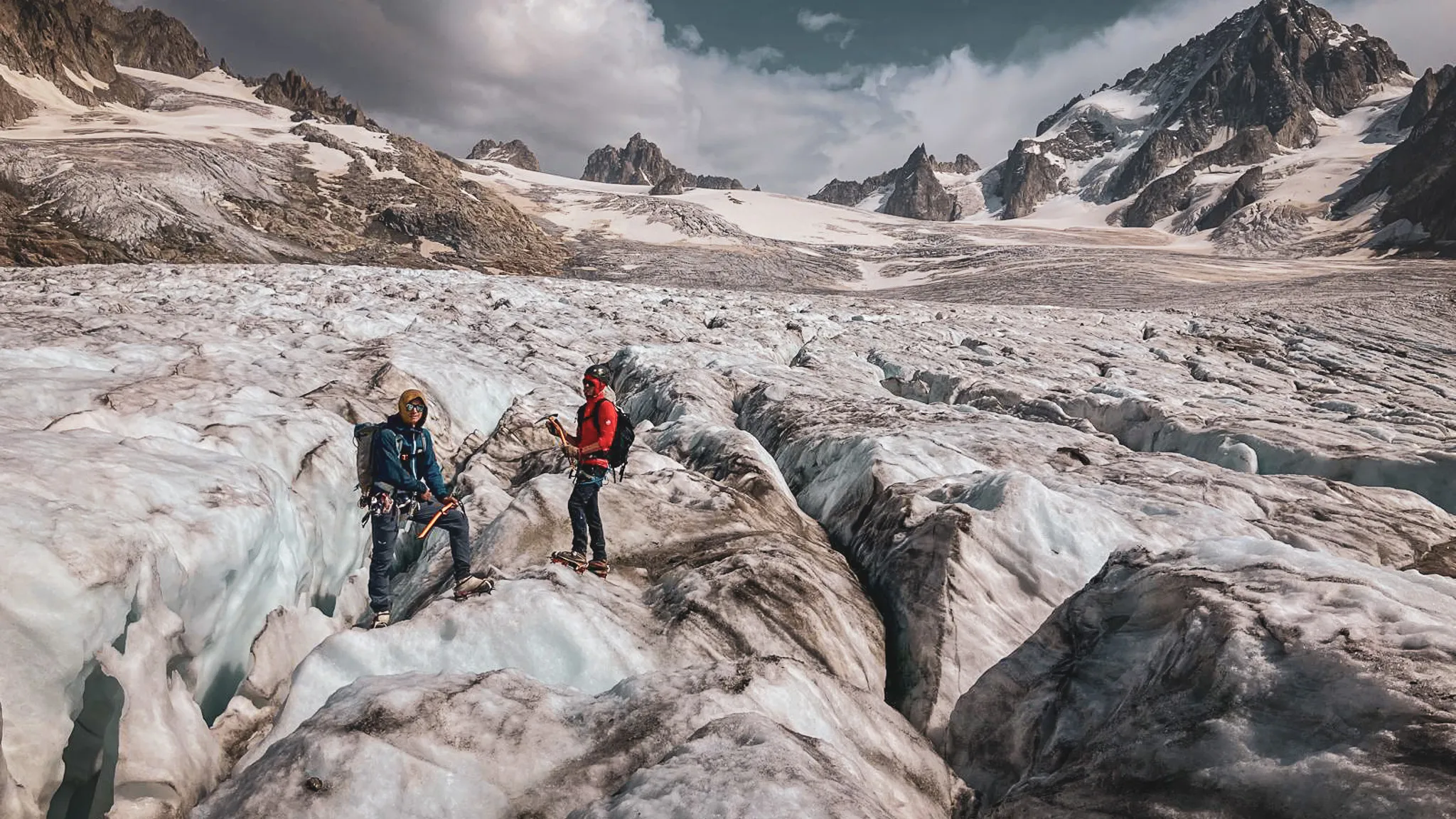 Two beginner mountaineers exploring a glacier near the Albert 1er hut on an introductory course
